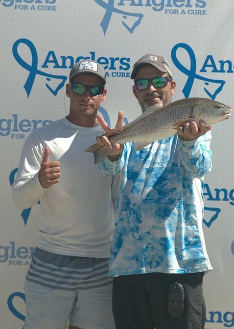 Anglers for a Cure 2018 competitors show off their fresh catch.
